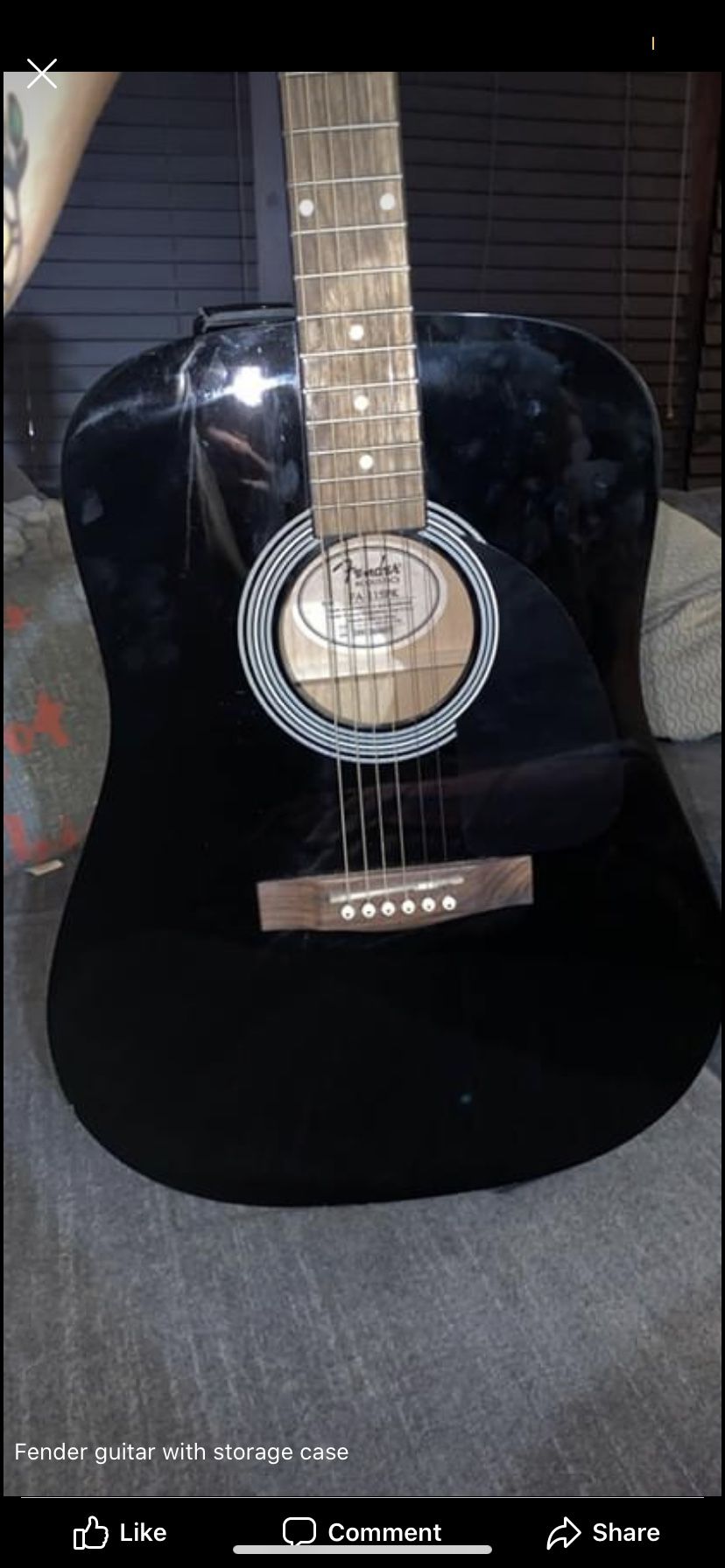 Black fender acoustic guitar