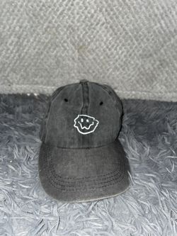 washed cotton baseball cap with an embroidered smiley face design!