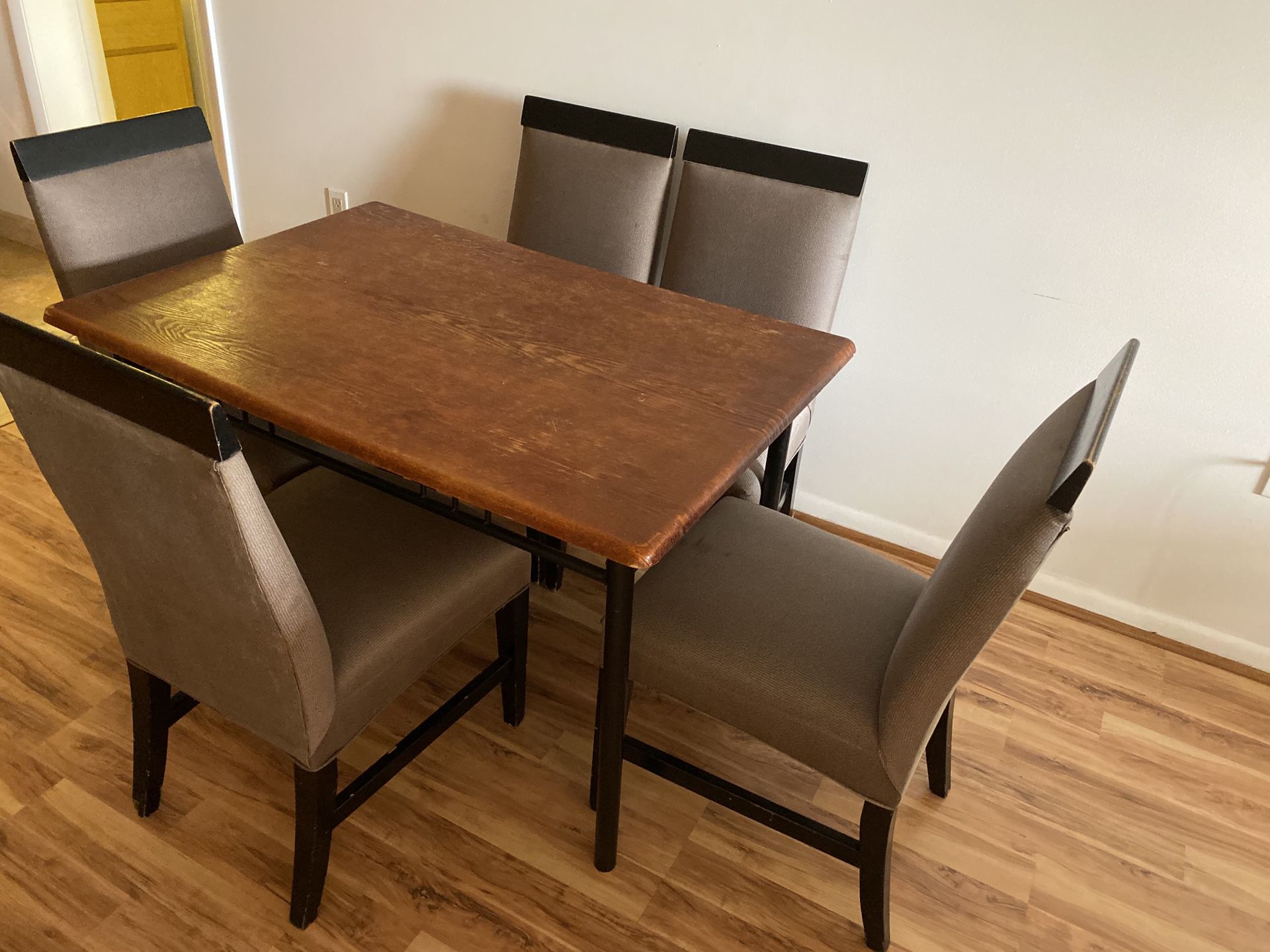Dining room table with 5 custom made chairs.