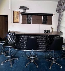 Homew bar with black tufted leather