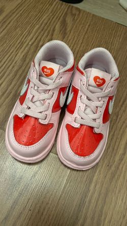 Red and pink Nike shoes