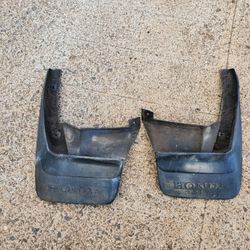 Mud flaps off a 1991 Honda CRX.                                                    parts