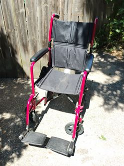 Two transport wheelchairs