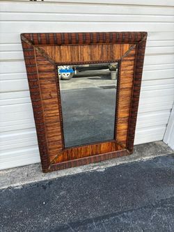 Beautifully crafted wooden frame mirror.  Wicker  frame mirror solid wood back… beveled mirror 39 “ x 50 “ $295
