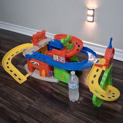 Fisher-Price Little People Sit 'N Stand Skyway 2-In-1 Vehicle Racing Playset.