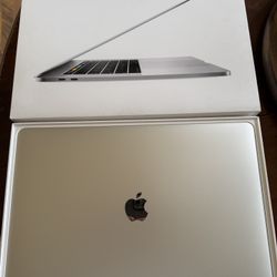 Apple MacBook 15.6” Touch Bar laptop 