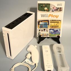 Nintendo Wii. With Wii Play. Works Great. 