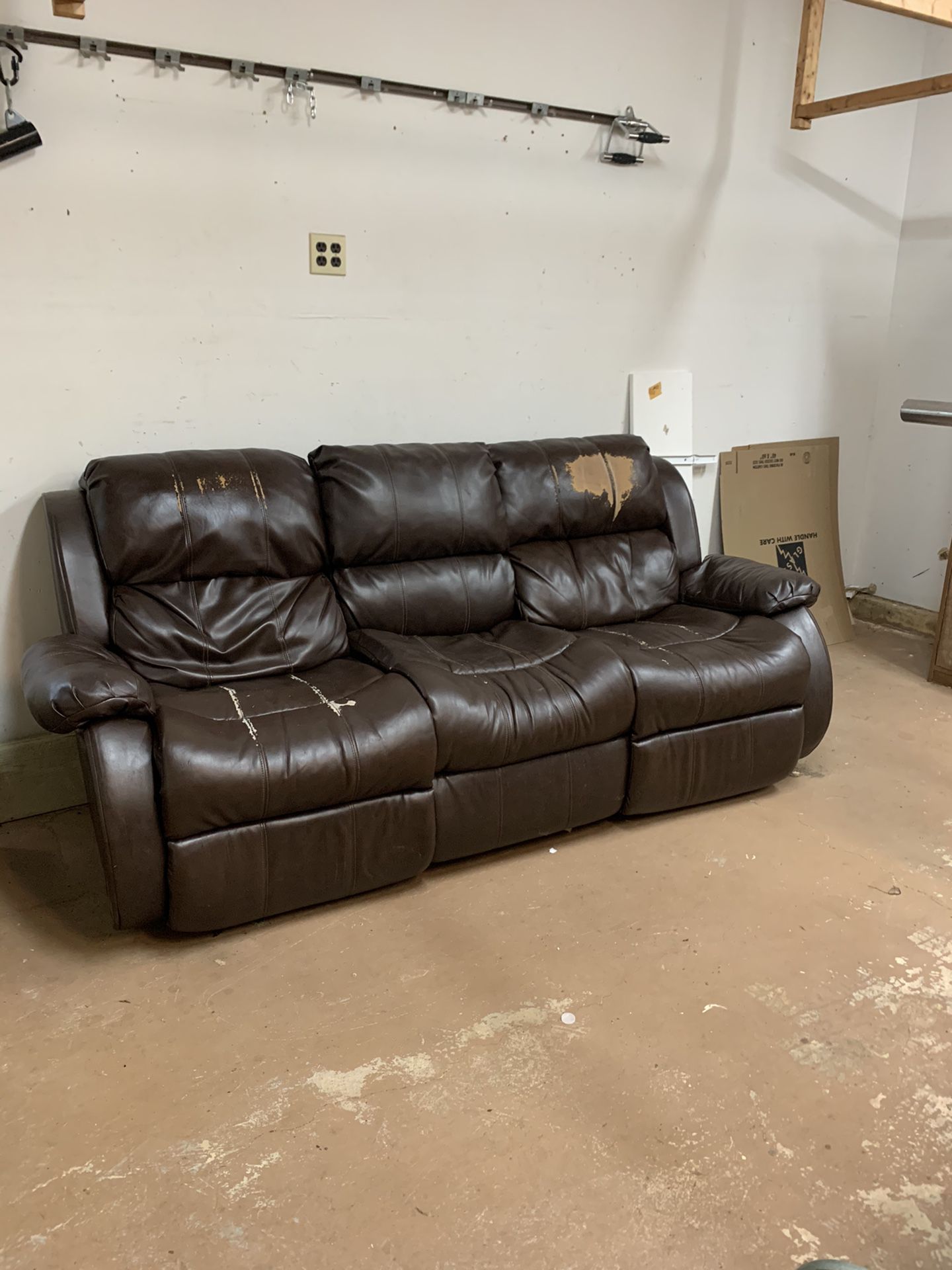 FREE ! Leather feel sofa with two builtin recliners.