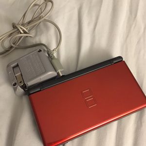 Photo Red Nintendo DS lite in excellent condition with New Super Mario Bros game. Only $40