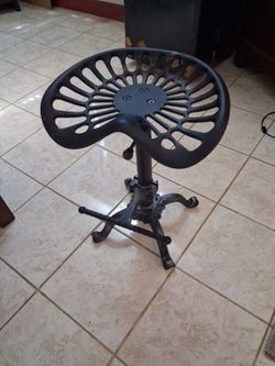 Black industrial tractor stool with swivel seat