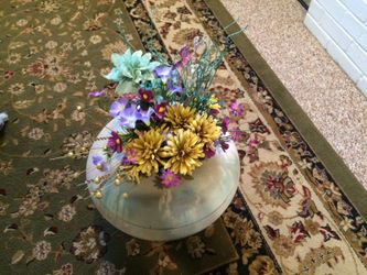 FLOWER ARRANGEMENT IN A GREEN AND GOLD DESIGNER VASE