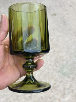  Vintage Green Glass Goblet  Elegant vintage green glass goblet, perfect for decor or use.  In great condition  Pick up location is around Greenhouse 