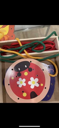 Wooden lacing game