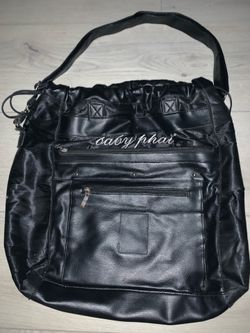 a Baby Phat black faux leather drawstring shoulder bag