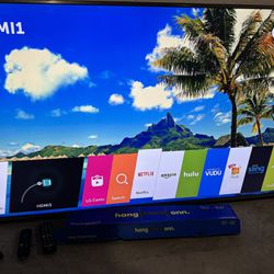 65 INCH LG Smart Tv Comes with Original remote Gently Used Roku Tv and Stand (spare screws included)