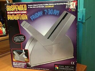 NIB SUSPENDED ANIMATION ALARM CLOCK WITH A MESSAGE SILVER W/ BLUE LED