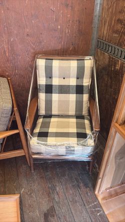 Wooden chair with black and white checkered cushions