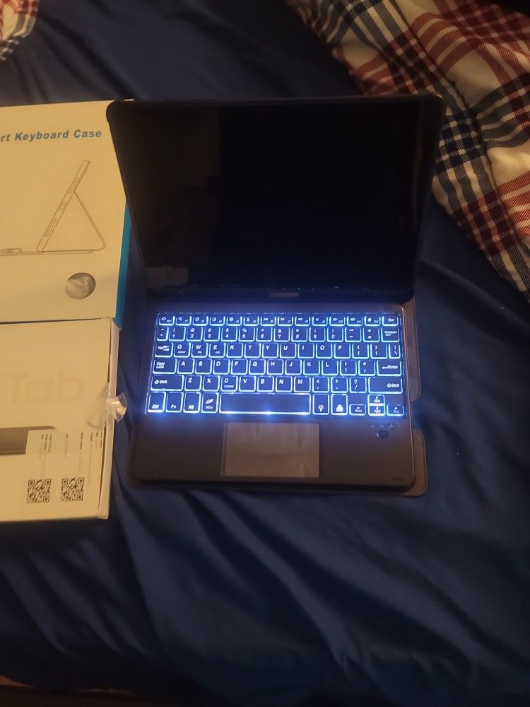Brand New Galaxy Tab A9+ With Changing Color Smart Keyboard Case.