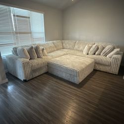 Fluffy Grey Sectional With ottoman 