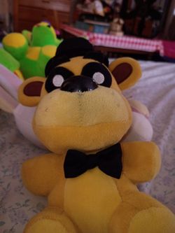 Rare golden Freddy plush funko no tush tag but real has a rip on the arm