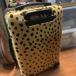 Calpak Chipp 2-piece hardshell spinner suitcase set in a leopard