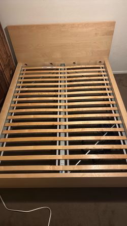 Wooden queen bed frame with slats