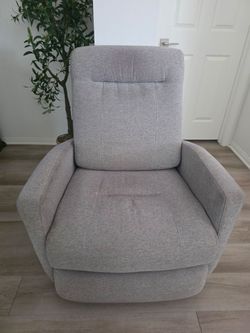 Chair power swivel glider recliner in a light gray polyester fabric.