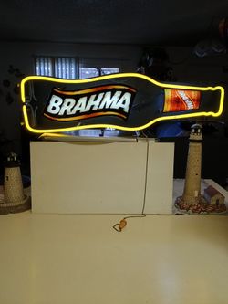 Neon, old school glass.  Brahma, a Brazilian Beer.  Light may sit on a shelf, mount on a wall, or hung in a window.