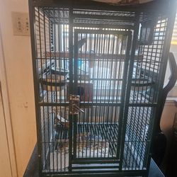 Wrought Iron Birdcage Green In Color With Two Parakeets