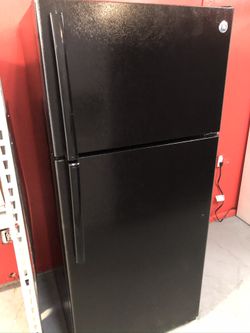 Used GE top and bottom fridge. 1 year warranty
