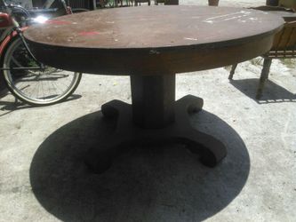 Solid oak round antique farm table.