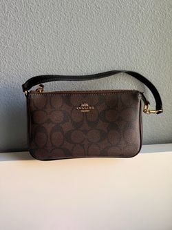 Coach Nolita 19 in signature canvas