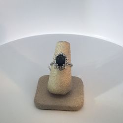 Lady’s Withe 14Karat Fashion Ring Size 5.75 With Various Shape Diamonds And A Center Estate Sapphire From Austria 