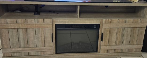 Rustic wood TV stand with electric fireplace
