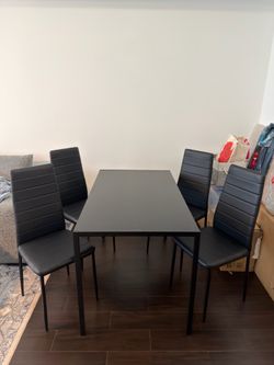4 chairs and glass dining table