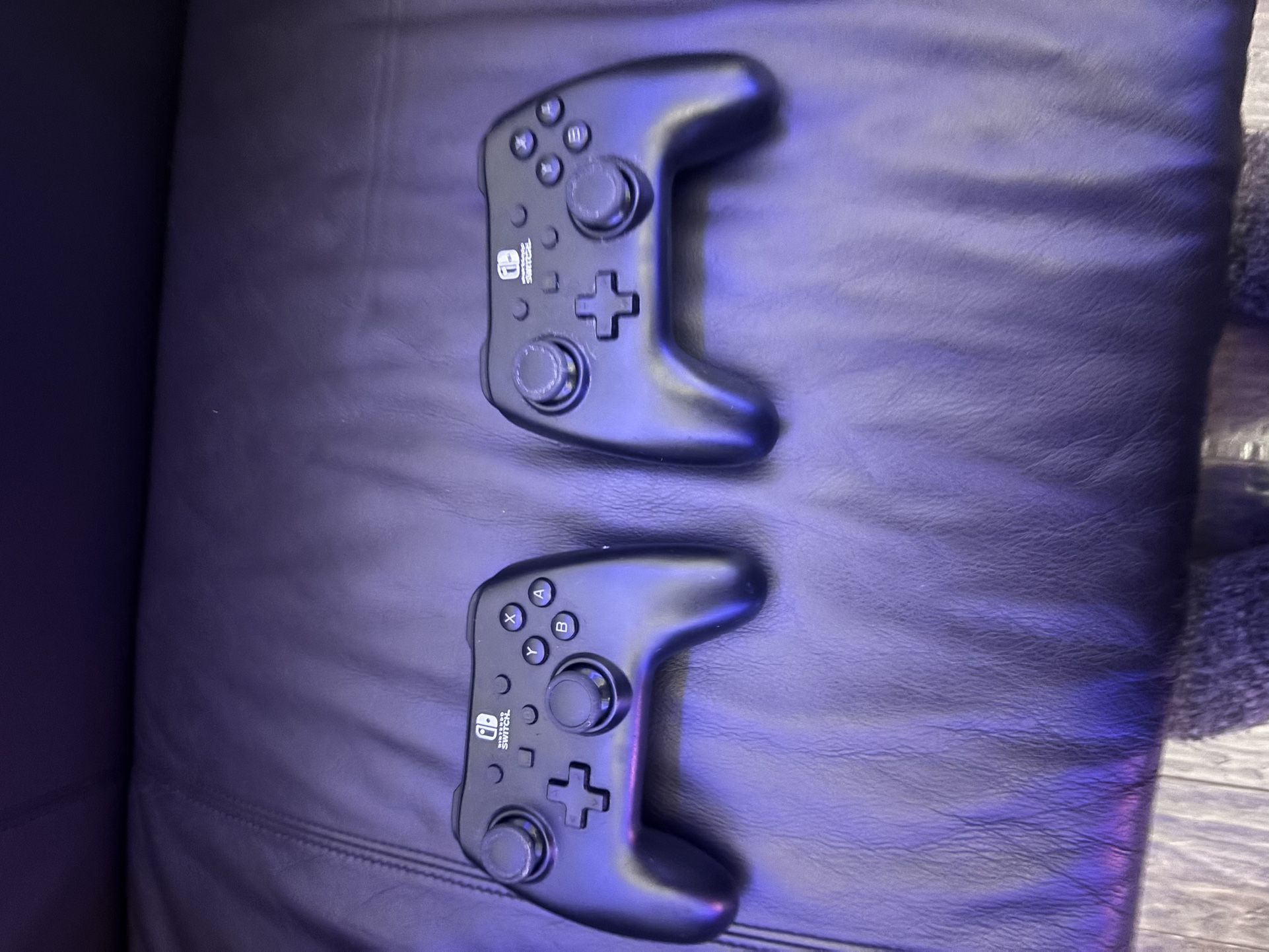 Two Nintendo switches remotes