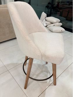 White cloth barstools.