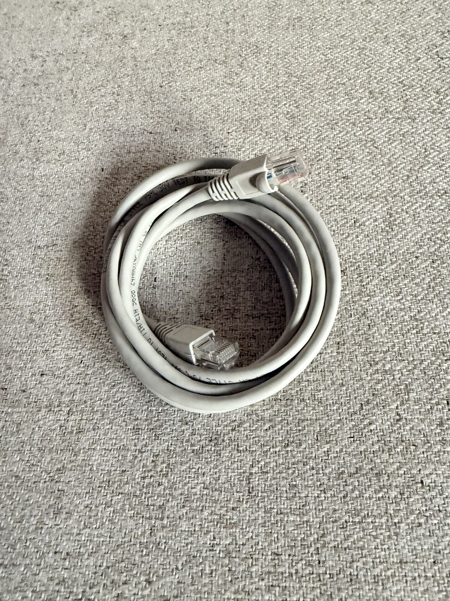 Category 5e (Cat5e) Ethernet cable, which is a type of twisted pair cable used for carrying signals in computer networks like Ethernet.  It's primaril