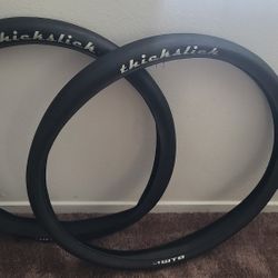 USED THICK SLICK TIRES SET 