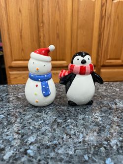 Ceramic Christmas Holiday Snowman & Penguin Pair of Salt & Pepper Shakers. Size tallest approximately 4 1/2 inches tall. Preowned never used. Has b