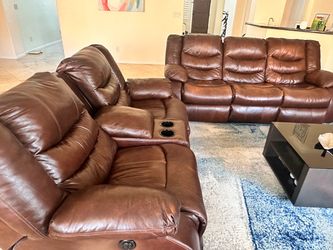 Brown Ashley reclining sofa and loveseat set