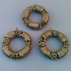 3 Beautiful Gold Wreath Metallic Ornaments - 6” Diameter ($12); 2 Red Hexagon Candle Holders ($6)
