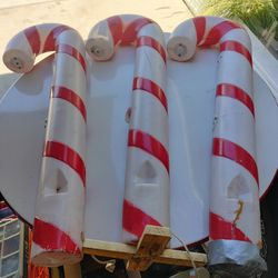 Unknown brand. 40-in tall blow mold candy canes with light kits. Kind of rough shape.
