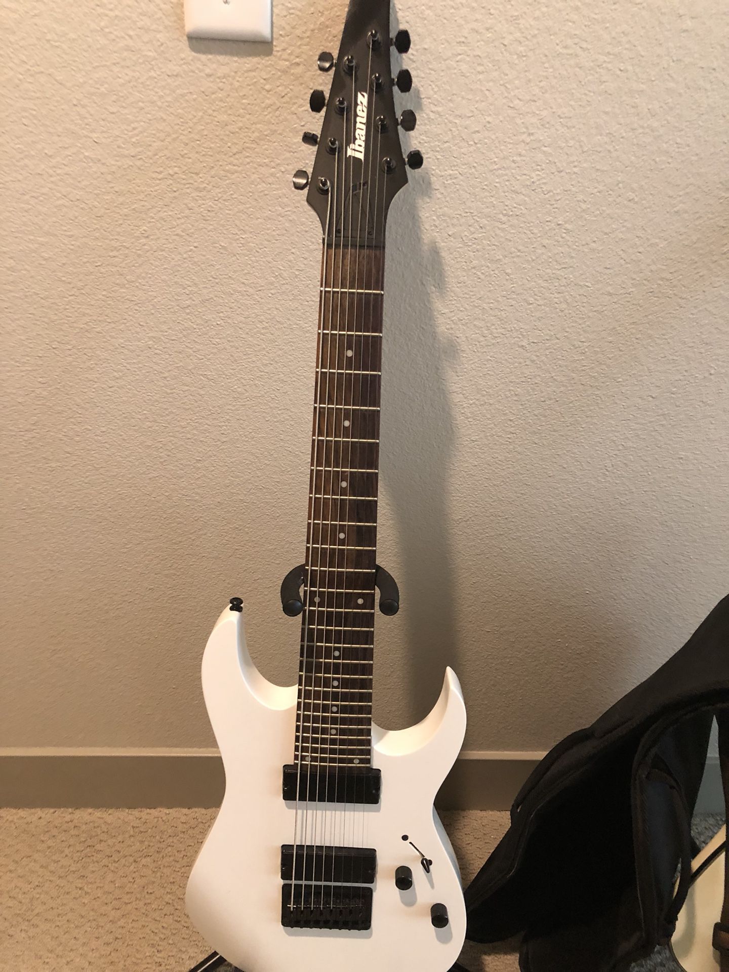 White Ibanez 8-string electric guitar