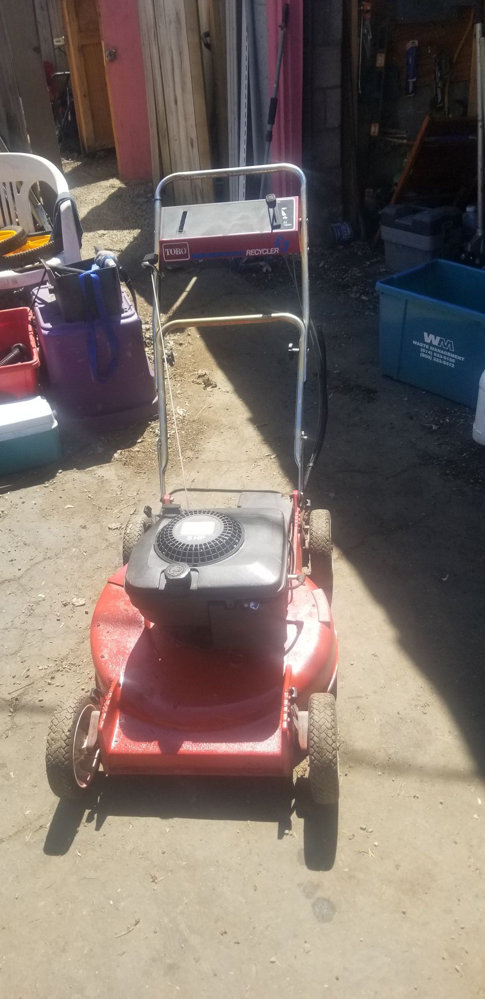 Red Toro mulching push lawn mower