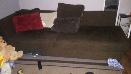 Brown couch 7 pillows