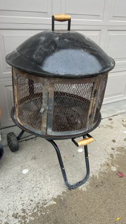 Portable steel fire pit with 28” fire bowl wheels for easy mobility coated base & lid for durability