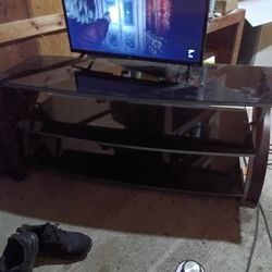 Black and wood frame t.v. stand