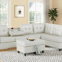 New White Leather Reversible Sectional And Ottoman 