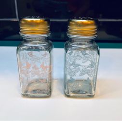 Beautiful glass salt and pepper shakers with colorful butterflies